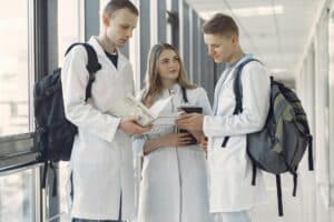 group of medical students at the hallway sharing notes